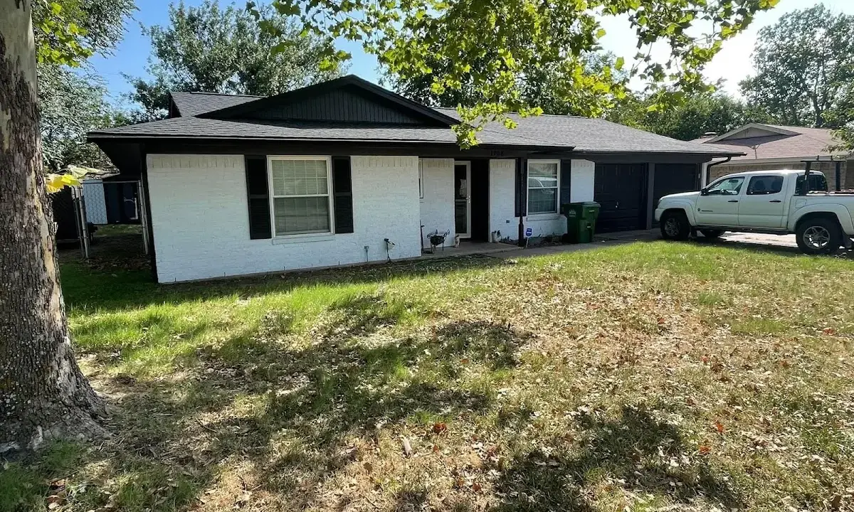 Professional roofing crew working on a residential roof in Opa-locka